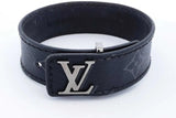 Black leather bracelet with silver logo on a white background