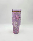 Floral-patterned tumbler on a white background
