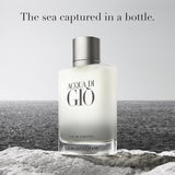 Giorgio Armani Acqua di Giò perfume bottle with ocean background