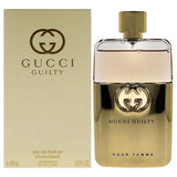 Gucci Guilty perfume bottle and packaging on a white background