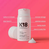 K18 hair mask bottle with text on a pink background