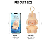 Product size comparison with an iPhone 13 showing a plush toy keychain.