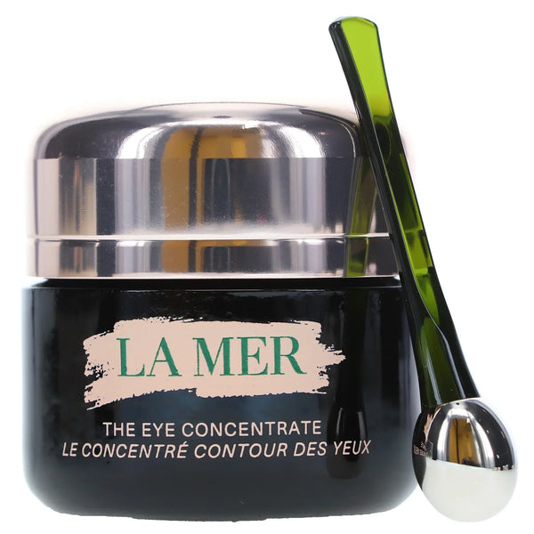 La Mer eye cream jar with a green applicator on a white background