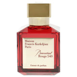 Maison Francis Kurkdjian perfume bottle with red glass and gold cap on a white background