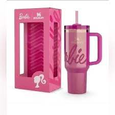 Pink 'Barbie' mug with straw and packaging on a white background