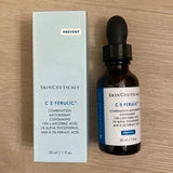 SkinCeuticals C E Ferulic skincare serum and packaging on a wooden surface