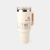 Stanley travel mug with handle on a white background