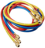 Set of colorful hoses with brass connectors on a white background